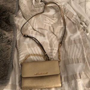 Michael Kors leather small crossbody purse in gold